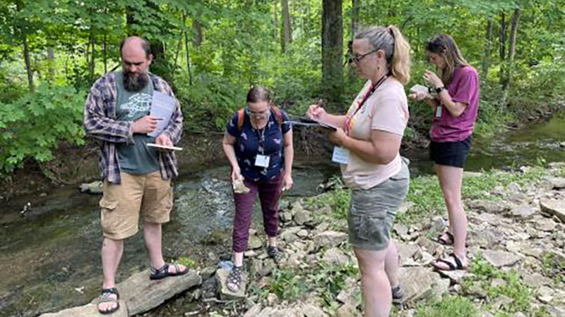 Participants working on a project outdoors