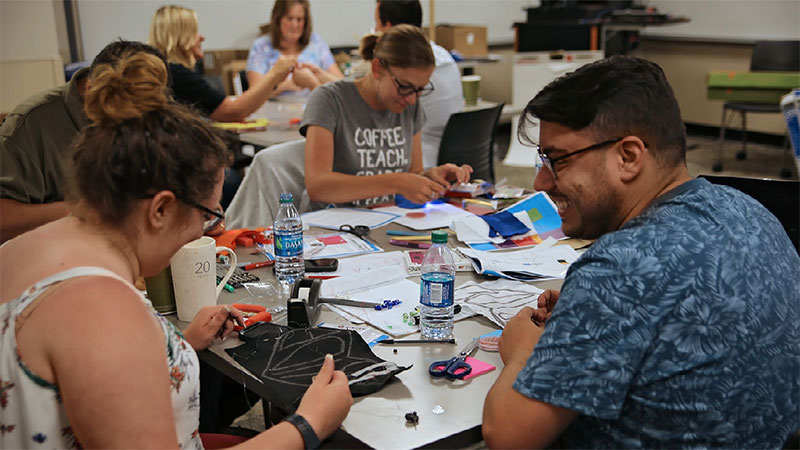 Teachers creating art projects together