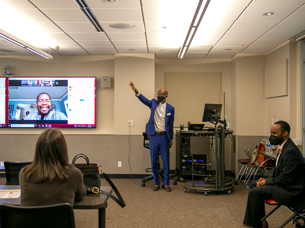 Eddie R. Cole, center, speaks during an alumni author series discussion at the IU School of Education.